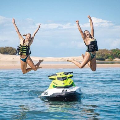 Mother and Teen Daughter Jumping — Jet Ski Hire and Tours in Main Beach, QLD
