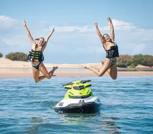 Two Women Jumping From the Jet Ski