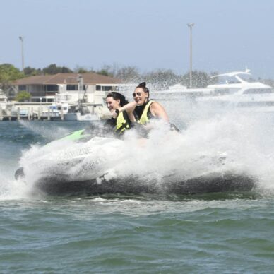 Two Ladies on a Jet Ski — Jet Ski Hire and Tours in Main Beach, QLD