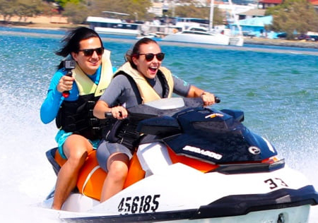 Two People Enjoying the Jet Ski while Holding the Action Camera