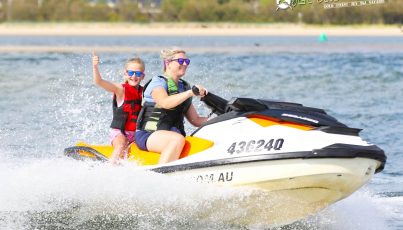 Mother and Son on a Jet Ski — Jet Ski Hire and Tours in Main Beach, QLD