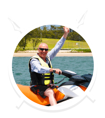 A Middle Aged Man with Shades Enjoying the Jet Ski in Main Beach, QLD